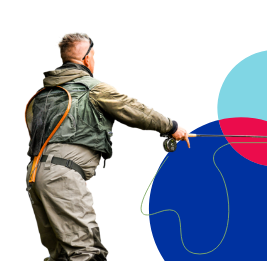 Fisherman in waders casting a fly fishing rod